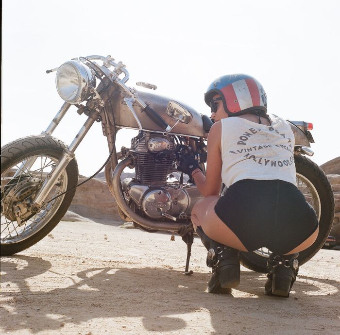 A playful frame from Girls on a motorcycle — online in Soacha